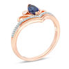 Thumbnail Image 1 of Marquise Lab-Created Blue Sapphire and 0.04 CT. T.W. Diamond Scroll Accent Chevron Promise Ring in 10K Rose Gold