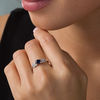 5.0mm Lab-Created Blue Sapphire and 0.04 CT. T.W. Diamond Leaf-Sides Vintage-Style Promise Ring in 10K White Gold