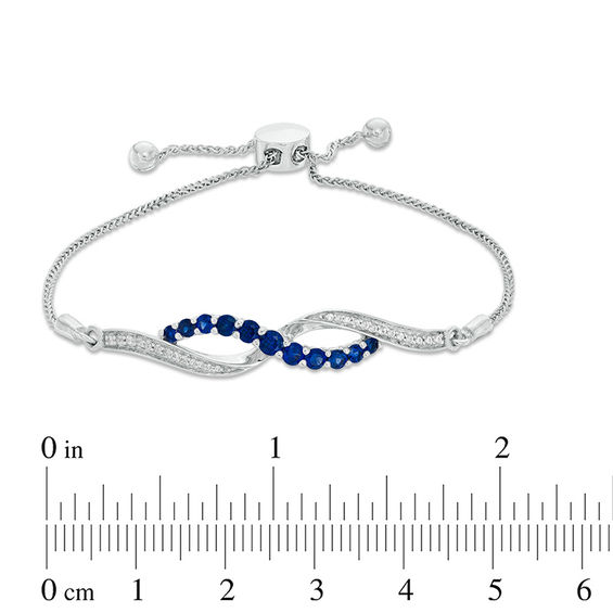 Lab-Created Blue and White Sapphire Infinity Bolo Bracelet in Sterling Silver - 9.5"