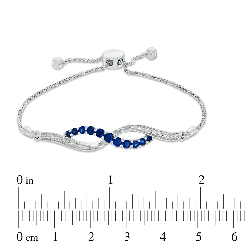 Lab-Created Blue and White Sapphire Infinity Bolo Bracelet in Sterling Silver - 9.5"