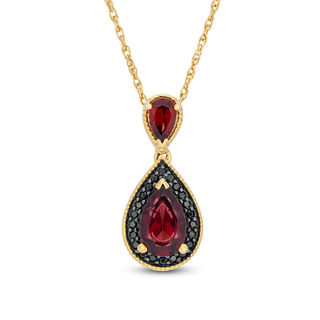 Oval Ruby and 0.04 CT. T.W. Diamond Tri-Top Pendant in 10K Gold