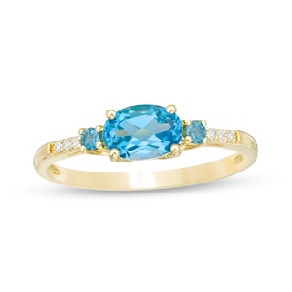 Sideways Oval Blue Topaz and Diamond Accent Ring in 10K Gold