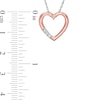 0.086 CT. T.W. Diamond Reversible Heart Outline Pendant in 10K Two-Tone Gold