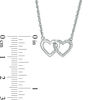 0.115 CT. T.W. Enhanced Black and White Diamond Reversible Interlocking Hearts Necklace in Sterling Silver - 17.37"