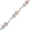 Thumbnail Image 0 of 0.087 CT. T.W. Diamond Double Heart Wave Bracelet in Sterling Silver and 10K Rose Gold - 7.5"
