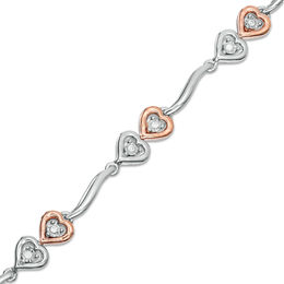 0.087 CT. T.W. Diamond Double Heart Wave Bracelet in Sterling Silver and 10K Rose Gold - 7.5&quot;