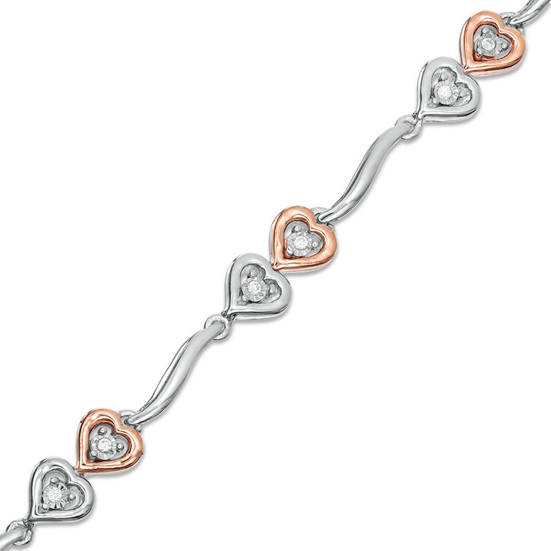 0.087 CT. T.W. Diamond Double Heart Wave Bracelet in Sterling Silver and 10K Rose Gold - 7.5"