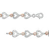 Thumbnail Image 1 of 0.23 CT. T.W. Diamond Alternating Sideways Heart Bracelet in Sterling Silver and 10K Rose Gold - 7.5"