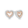 0.04 CT. T.W. Diamond Double Heart Outline Stud Earrings in Sterling Silver and 10K Rose Gold