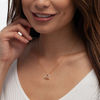 0.085 CT. T.W. Diamond Tilted Layered Double Heart Pendant in 10K Gold