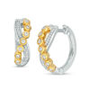 Thumbnail Image 0 of 0.18 CT. T.W. Diamond Bezel-Set Crossover Hoop Earrings in 10K Two-Tone Gold