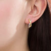 Thumbnail Image 1 of 0.18 CT. T.W. Diamond Bezel-Set Crossover Hoop Earrings in 10K Two-Tone Gold
