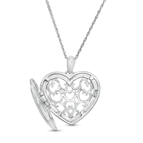 0.085 CT. T.W. Diamond Heart Outline with Star Locket in Sterling Silver