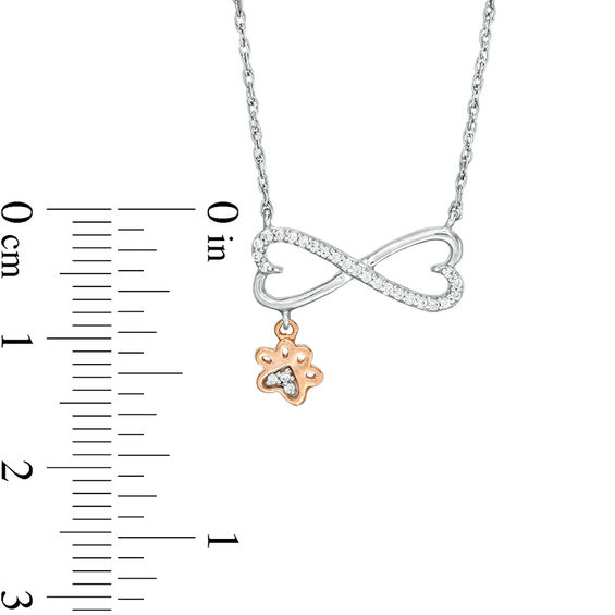 0.067 CT. T.W. Diamond Sideways Heart Infinity with Paw Print Dangle Necklace in Sterling Silver and 10K Rose Gold