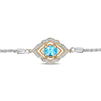 Enchanted Disney Aladdin Oval Swiss Blue Topaz and 0.065 CT. T.W. Diamond Bolo Bracelet in Sterling Silver and 10K Gold