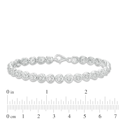 0.086 CT. T.W. Diamond Love Knot Tennis Bracelet in Sterling Silver - 7.5"