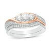 0.45 CT. T.W. Diamond Three Stone Open Bypass Bridal Set in 10K Two-Tone Gold