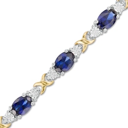 Oval Lab-Created Blue Sapphire and 0.086 CT. T.W. Diamond &quot;X&quot; Bracelet in Sterling Silver and 14K Gold Plate - 7.25&quot;