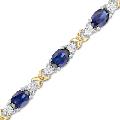 Oval Lab-Created Blue Sapphire and 0.086 CT. T.W. Diamond "X" Bracelet in Sterling Silver and 14K Gold Plate - 7.25"