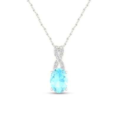 Oval Aquamarine and 0.04 CT. T.W. Diamond "X" Drop Pendant in 10K White Gold