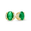 Thumbnail Image 0 of Oval Emerald and 0.04 CT. T.W. Diamond Collar Stud Earrings in 10K Gold