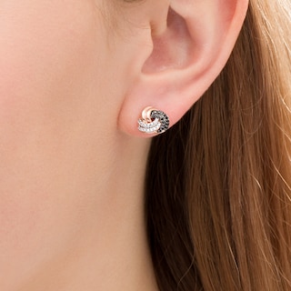 0.23 CT. T.W. Enhanced Black and White Diamond Love Knot Stud Earrings in 10K Rose Gold