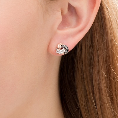 0.23 CT. T.W. Enhanced Black and White Diamond Love Knot Stud Earrings in 10K Rose Gold