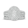 0.69 CT. T.W. Composite Diamond Triple Oval Frame Vintage-Style Multi-Row Bridal Set in 10K White Gold