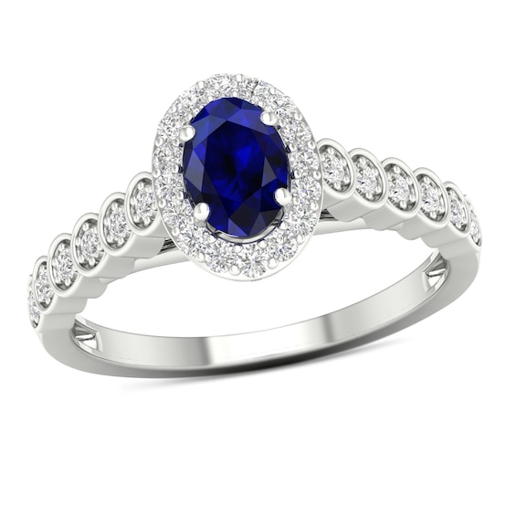 Oval Blue Sapphire and 0.20 CT. T.W. Diamond Frame Scallop Shank Ring in 10K White Gold