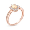 Oval Opal and 0.10 CT. T.W. Diamond Sunburst Frame Vintage-Style Tapered Shank Ring in 10K Rose Gold