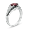 Oval Garnet and 0.085 CT. T.W. White and Black Diamond Bypass Frame Ring in Sterling Silver