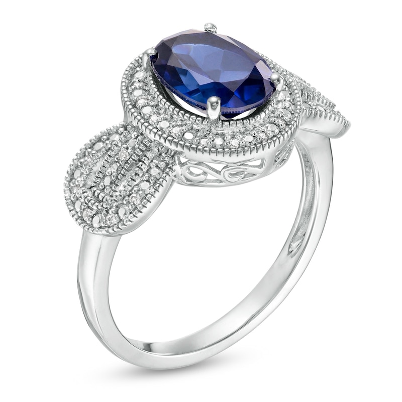 Oval Lab-Created Blue Sapphire and 0.065 CT. T.W. Diamond Vintage-Style Buckle Loop Ring in Sterling Silver