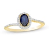 Thumbnail Image 0 of Oval Blue Sapphire and 0.12 CT. T.W. Diamond Frame Bypass Ring in 10K Gold