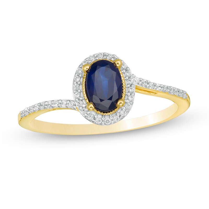 Oval Blue Sapphire and 0.12 CT. T.W. Diamond Frame Bypass Ring in 10K Gold