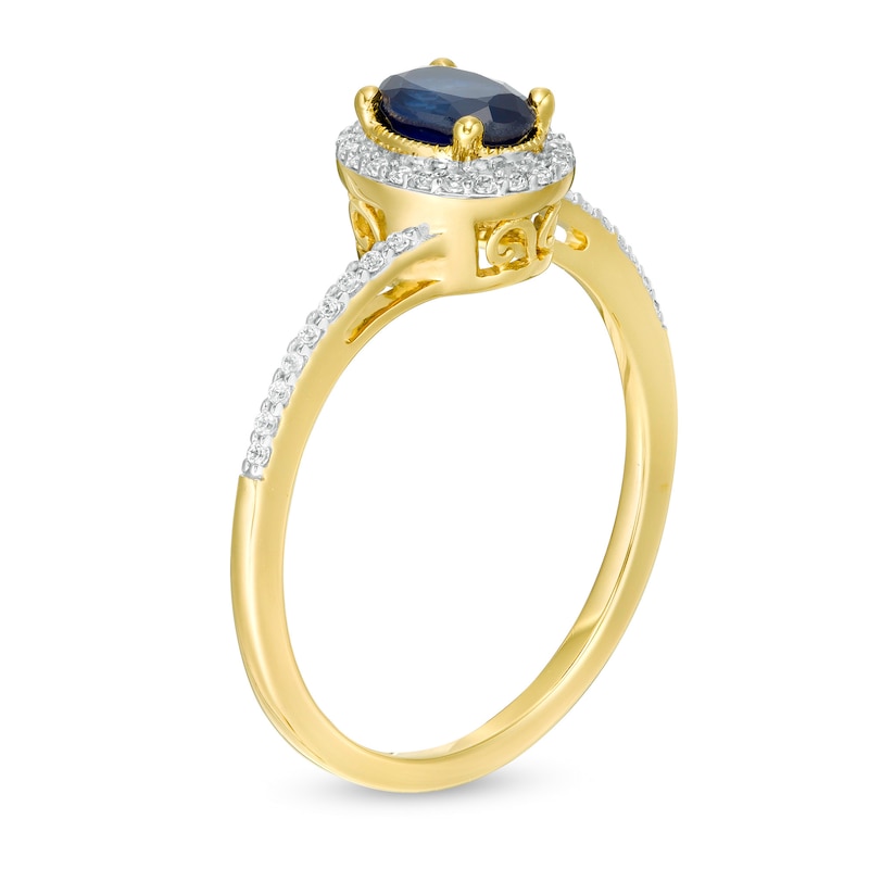 Oval Blue Sapphire and 0.12 CT. T.W. Diamond Frame Bypass Ring in 10K Gold