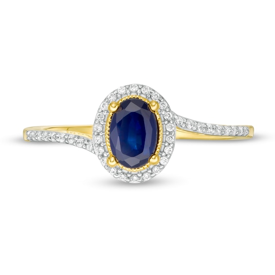 Oval Blue Sapphire and 0.12 CT. T.W. Diamond Frame Bypass Ring in 10K Gold