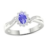 Oval Tanzanite and 0.12 CT. T.W. Diamond Sunburst Frame Twist Shank Ring in 10K White Gold