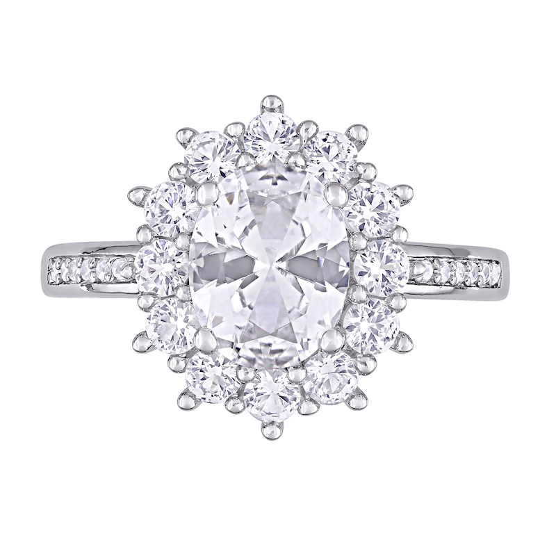 Oval Lab-Created White Sapphire and 0.04 CT. T.W. Diamond Starburst Frame Ring in Sterling Silver|Peoples Jewellers