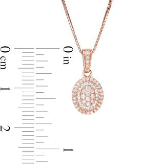 0.32 CT. T.W. Baguette and Round Composite Diamond Oval Frame Pendant in 10K Rose Gold