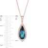 Thumbnail Image 1 of EFFY™ Collection Elongated Pear-Shaped London Blue Topaz and 0.21 CT. T.W. Diamond Teardrop Pendant in 14K Rose Gold