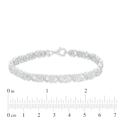 0.23 CT. T.W. Diamond Floral "XO" Link Bracelet in Sterling Silver - 7.25"