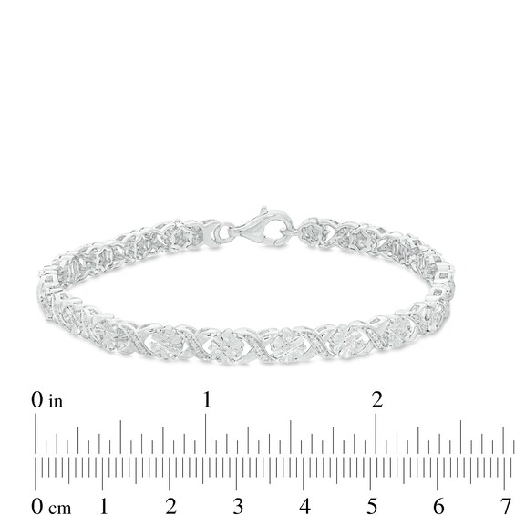 0.23 CT. T.W. Diamond Floral "XO" Link Bracelet in Sterling Silver - 7.25"