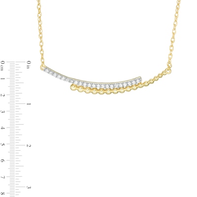 0.145 CT. T.W. Diamond Curved Beaded Ribbon Bypass Necklace in 10K Gold