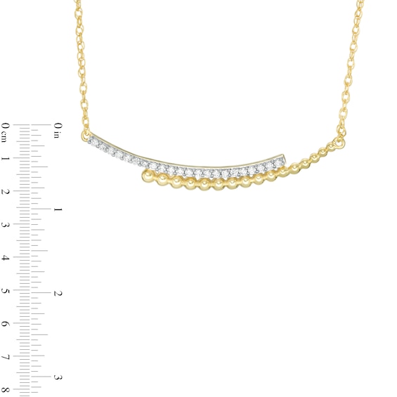 0.145 CT. T.W. Diamond Curved Beaded Ribbon Bypass Necklace in 10K Gold