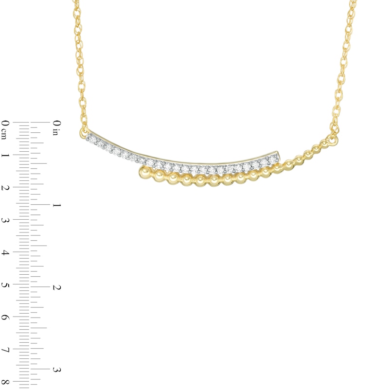 0.145 CT. T.W. Diamond Curved Beaded Ribbon Bypass Necklace in 10K Gold