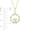 Thumbnail Image 1 of 0.115 CT. T.W. Composite Diamond Heart-Shaped Twist Circle Pendant in 10K Gold