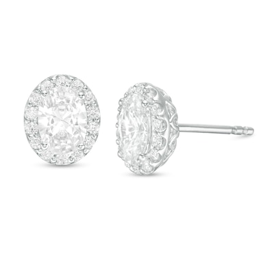 CT. T.W. Certified Oval Diamond Frame Stud Earrings in 14K White Gold (I/SI2