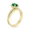 Oval Emerald and 0.33 CT. T.W. Diamond Frame Bridal Set in 14K Gold