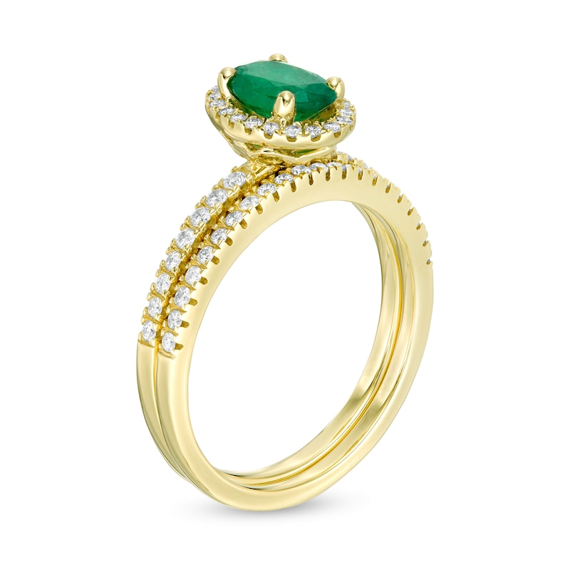 Main Image 3 of Oval Emerald and 0.33 CT. T.W. Diamond Frame Bridal Set in 14K Gold