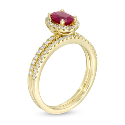 Oval Ruby and 0.33 CT. T.W. Diamond Frame Bridal Set in 14K Gold